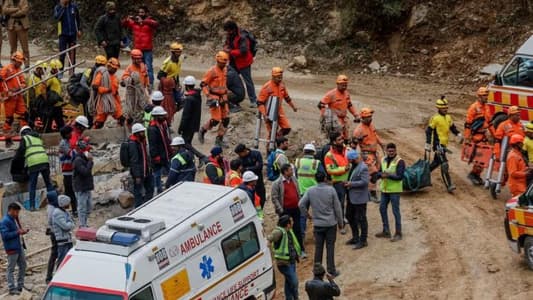 Indian rescuers break through debris to reach 41 men trapped in tunnel