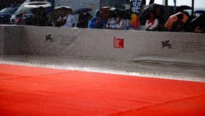 Rainstorm sends stars fleeing Venice red carpet