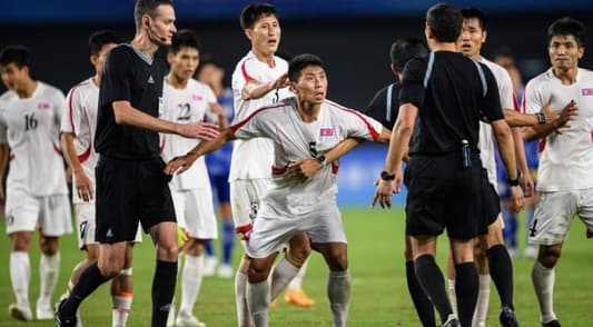 North Korean soccer players clash with referee after losing to Japan