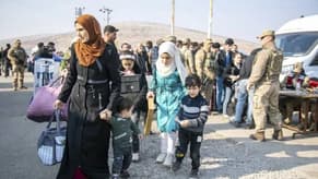 Refugees return to Syria as caretaker prime minister appointed