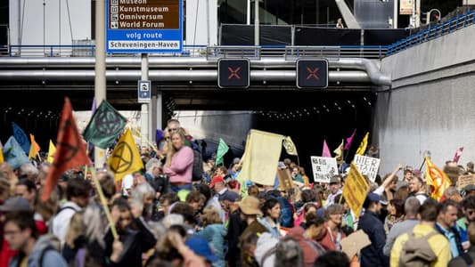 Climate protesters block Dutch highway while police strike