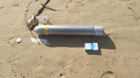 Photo: Unexploded rocket on the beach