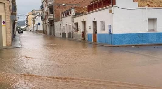 Madrid residents told to stay at home as torrential rain sweeps across Spain