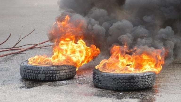 TMC: Naameh highway has been blocked to traffic in both directions with burning tires