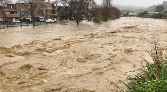 Torrential rain slammed the west and north of New Zealand's South Island for a third straight day on Thursday, forcing hundreds to evacuate their homes and triggering road and school closures and land slips