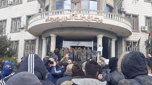Protesters storm governor's office in southern Syrian city, gunfire heard