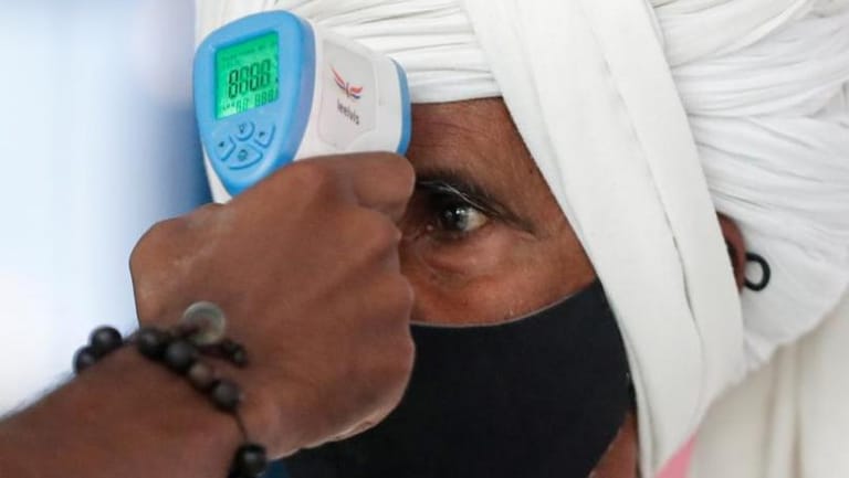 India's Maharashtra state imposes night curfew after record COVID jump