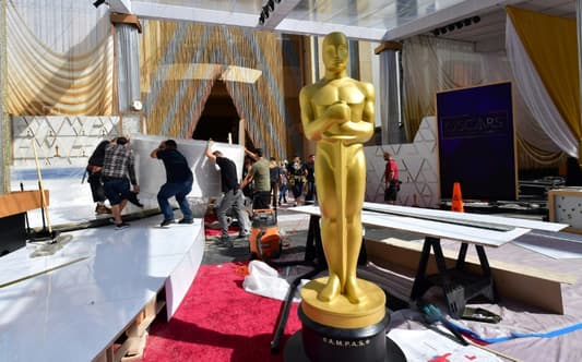 Journalists and production workers hit the red carpet in Hollywood, as the show business industry gathers for the 94th Academy Awards