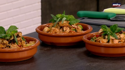 Shrimps with bulgur on tomatoes