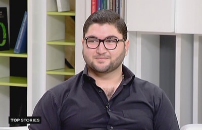 أصغر كاتب أيقونات في لبنان - مرشد الأحمر 