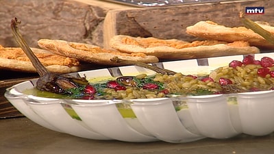 Eggplant with Butter, Almonds, Coriander, Freekeh and Pomegranate